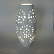Perforated ceramic lamp